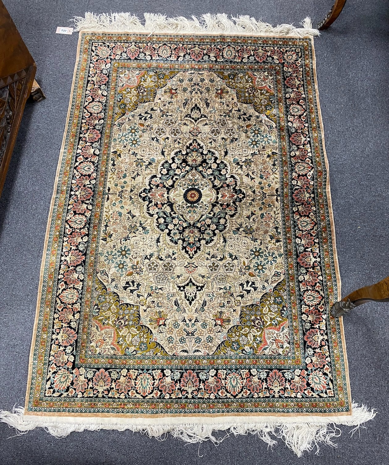 A North West Persian part silk ivory ground rug, 150 x 100cm